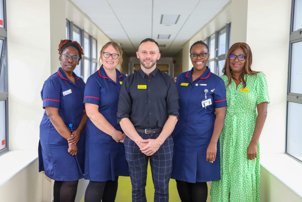 Pictured standing in a corridor are Meye Bevoro-Sami - Recruitment and Retention Preceptor Lead, Samantha Burton - Clinical Facilitator Maternity Support Worker Lead, Dr Gavin Guy, Fiona Drayton - Student Practice Development Midwife (PDM), and Dr Helen Gbinigie.